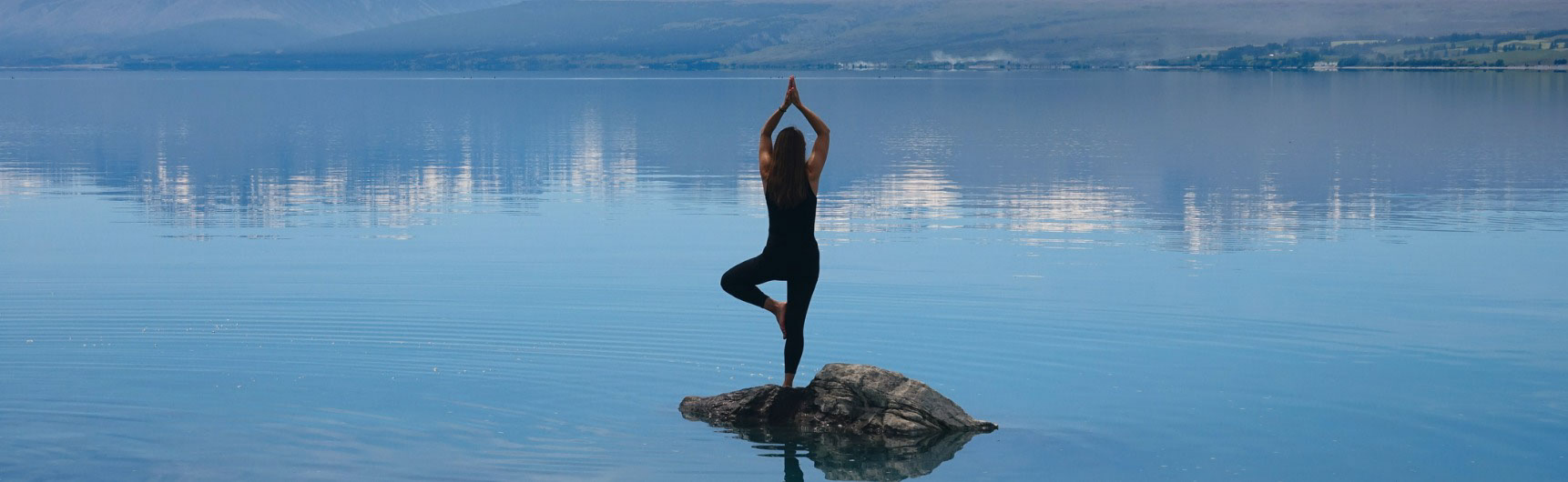 Lady on rock meditation