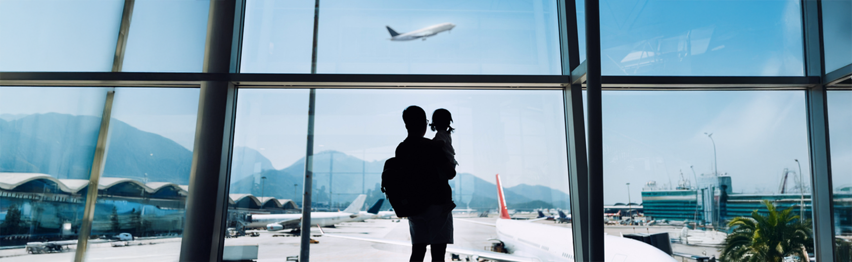Father and Daughter watching plane fly