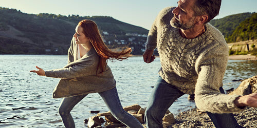 Southern Cross Health Insurance - Cancer Assist mobile banner A man and woman skimming stones on a lake